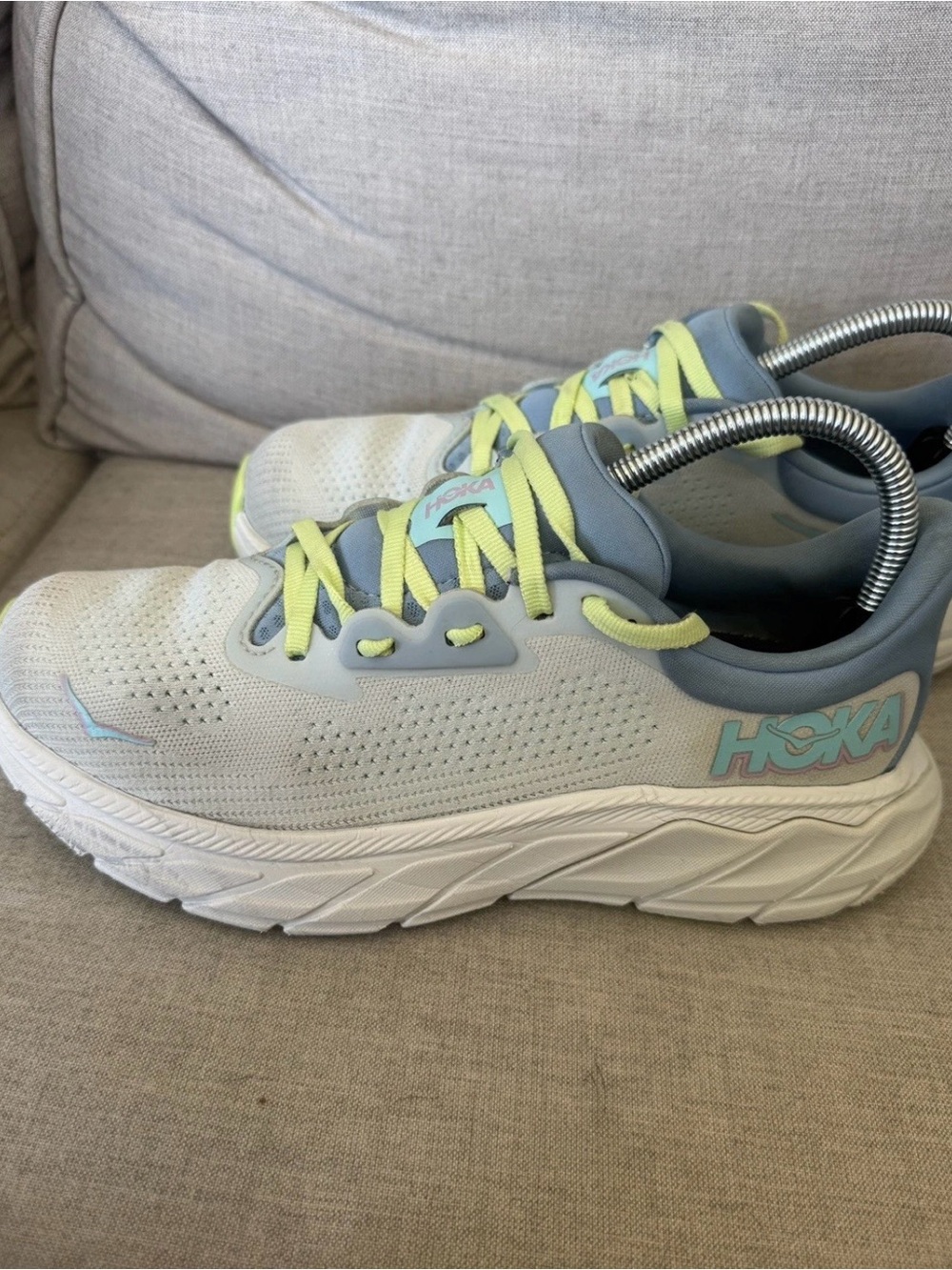 Hoka One One women’s White Sneakers with Light Blue and Neon Yellow Accents